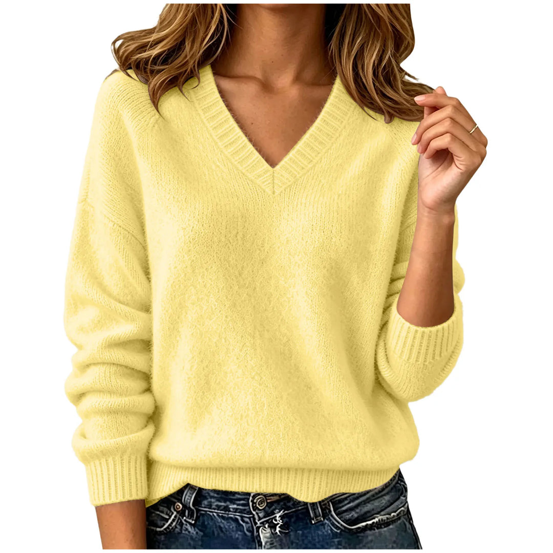 Woman wearing yellow oversized V-neck knit sweater