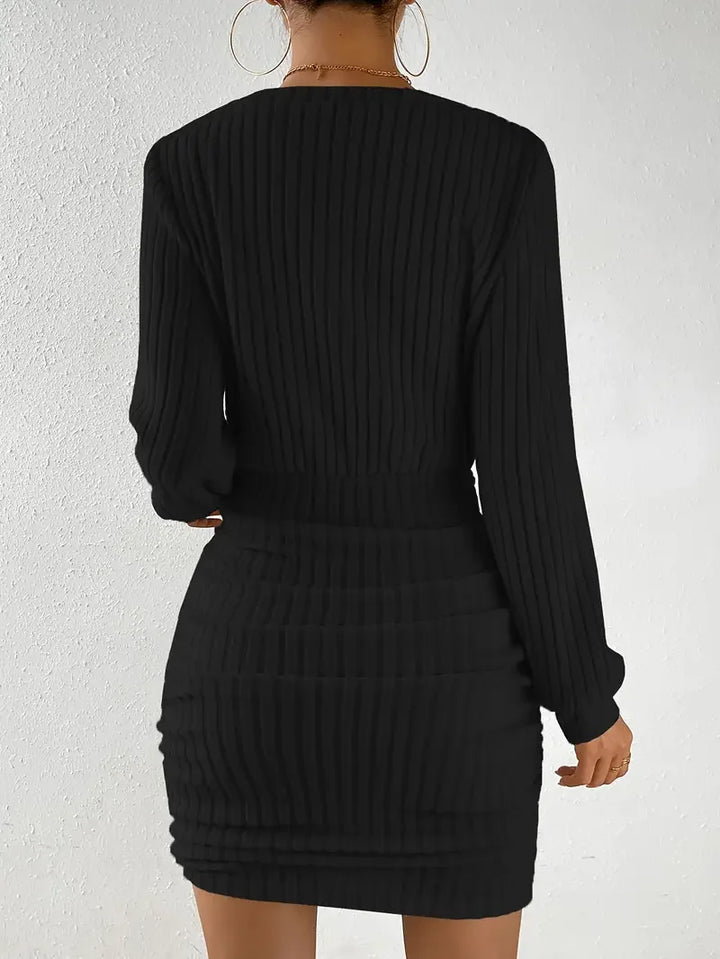 Black ribbed knit mini dress, back view
