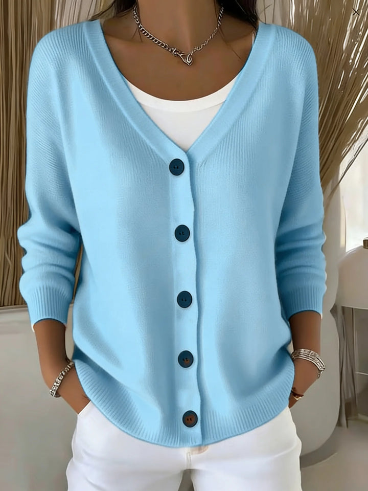 Woman wearing sky blue button front knit cardigan