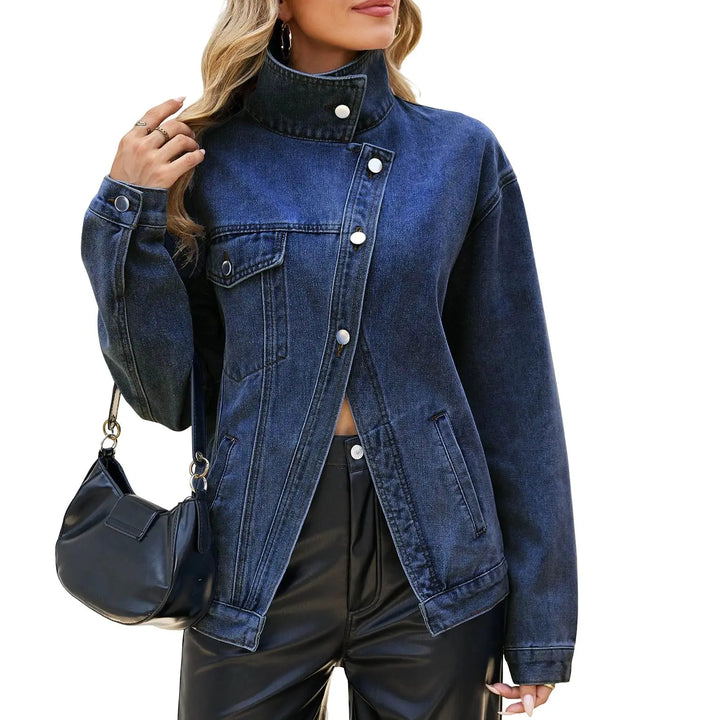 Woman wearing dark blue asymmetric denim jacket with stand collar