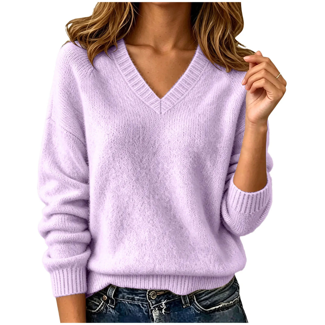 Woman wearing purple oversized V-neck knit sweater