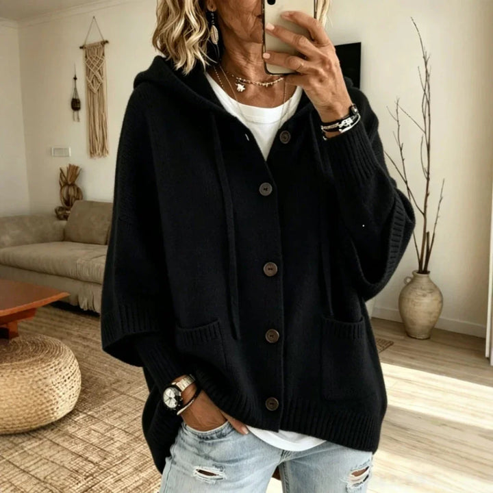 Woman wearing black hooded button-front cardigan