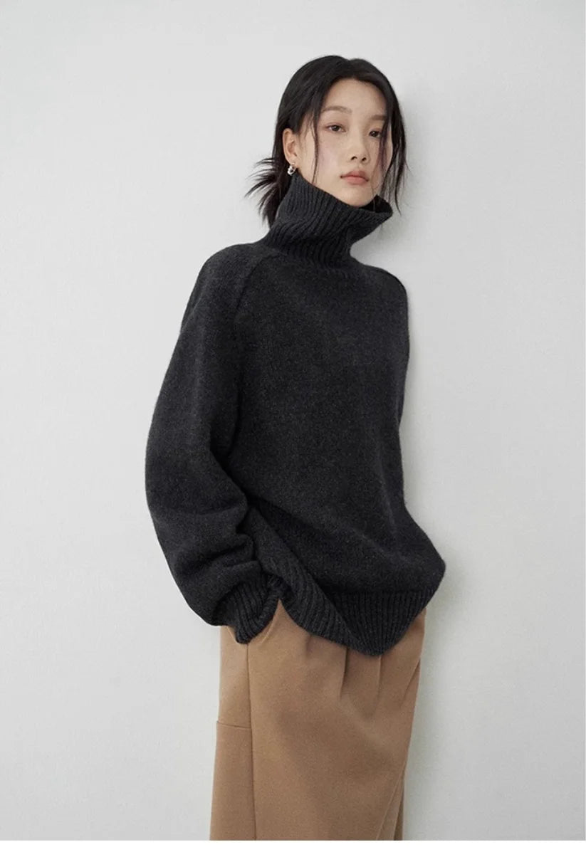 Woman wearing black oversized turtleneck sweater