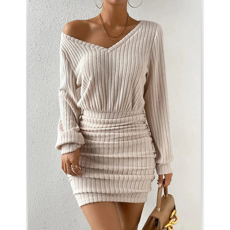 Woman wearing beige ribbed knit off-shoulder mini dress, front view
