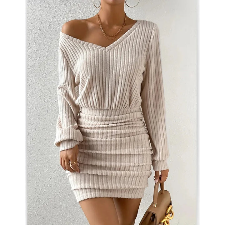 Woman wearing beige ribbed knit off-shoulder mini dress, front view