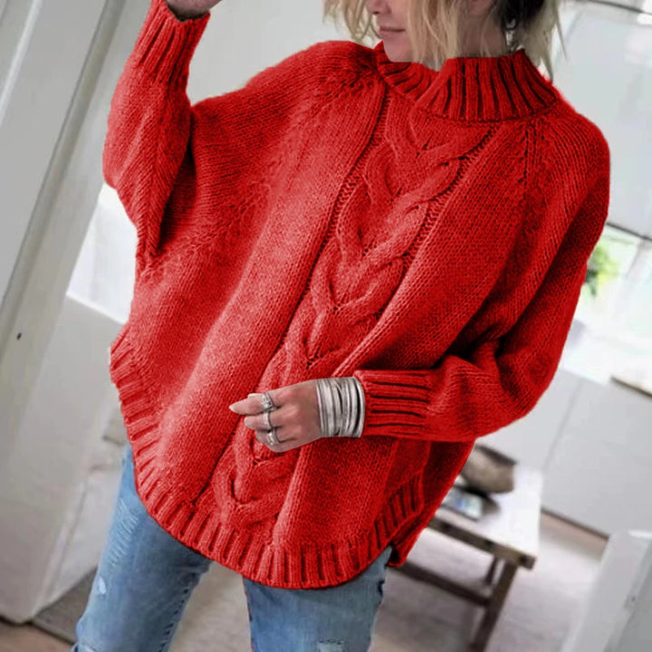 Woman wearing red cable knit oversized sweater, front view