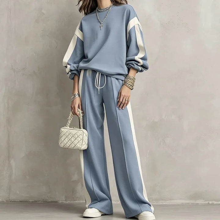 Woman wearing blue color block sweatshirt and wide leg pants set, front view