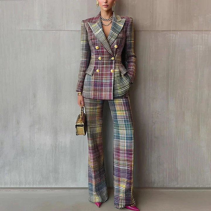 Close view of purple plaid double-breasted blazer and trouser suit against concrete wall