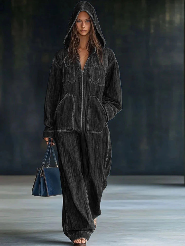 Woman wearing black hooded denim jumpsuit full length front view