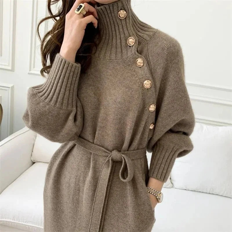 Close up of turtleneck sweater dress with asymmetric buttons in camel
