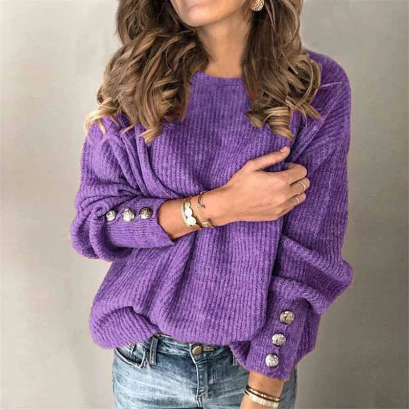 Woman wearing purple ribbed knit sweater with button cuffs, front view