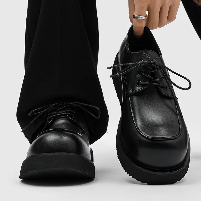 Model wearing black leather platform Derby shoes