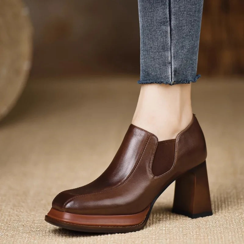 Front angle of brown leather square toe pump on platform sole