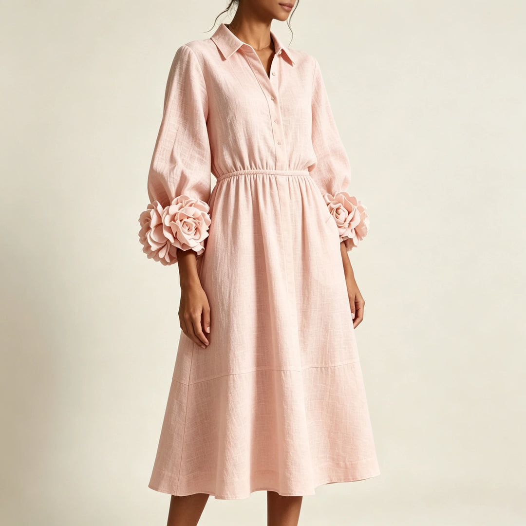 Close-up of pink midi dress showing point collar and floral cuffs