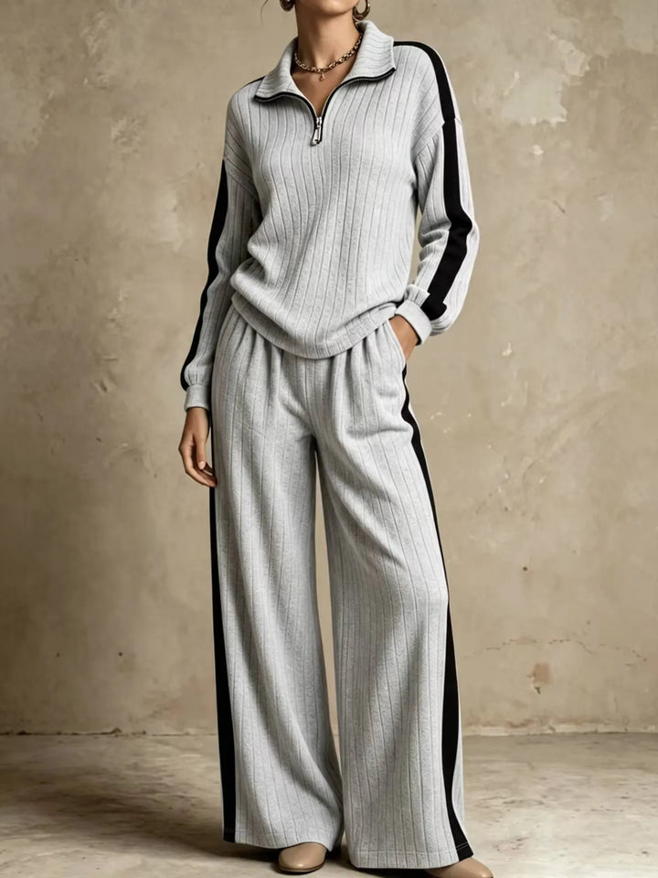 Woman wearing gray ribbed knit two piece set with black side stripe