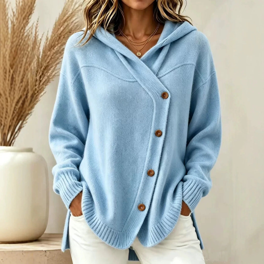 Woman wearing light blue hooded knit cardigan with asymmetric button placket