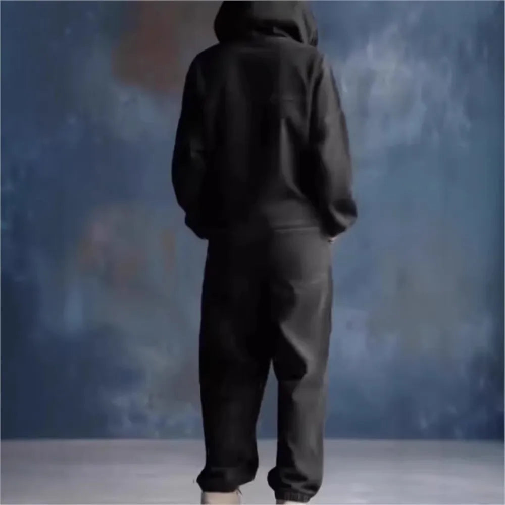 Back view of black hooded jumpsuit