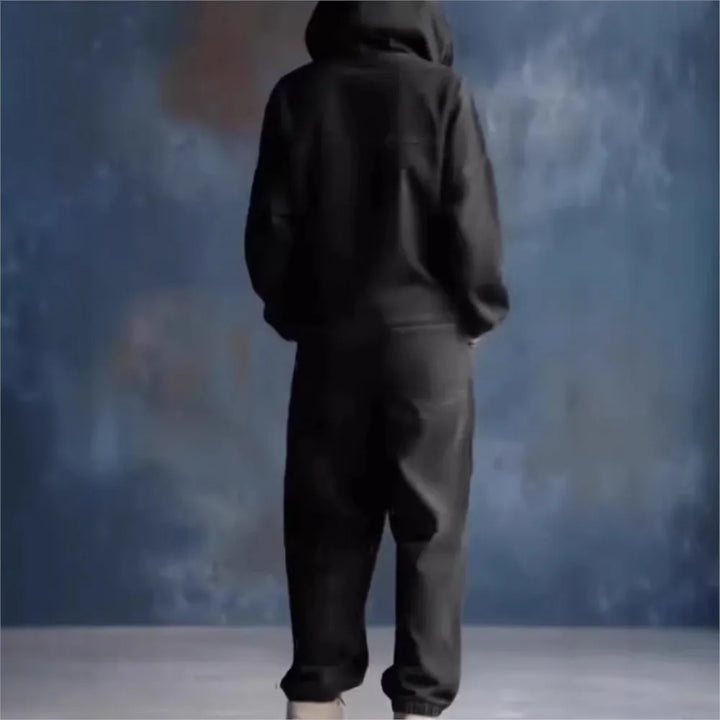 Back view of black hooded jumpsuit
