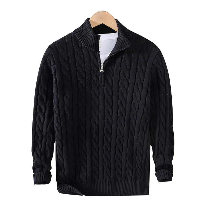 Black cable knit quarter zip sweater on hanger