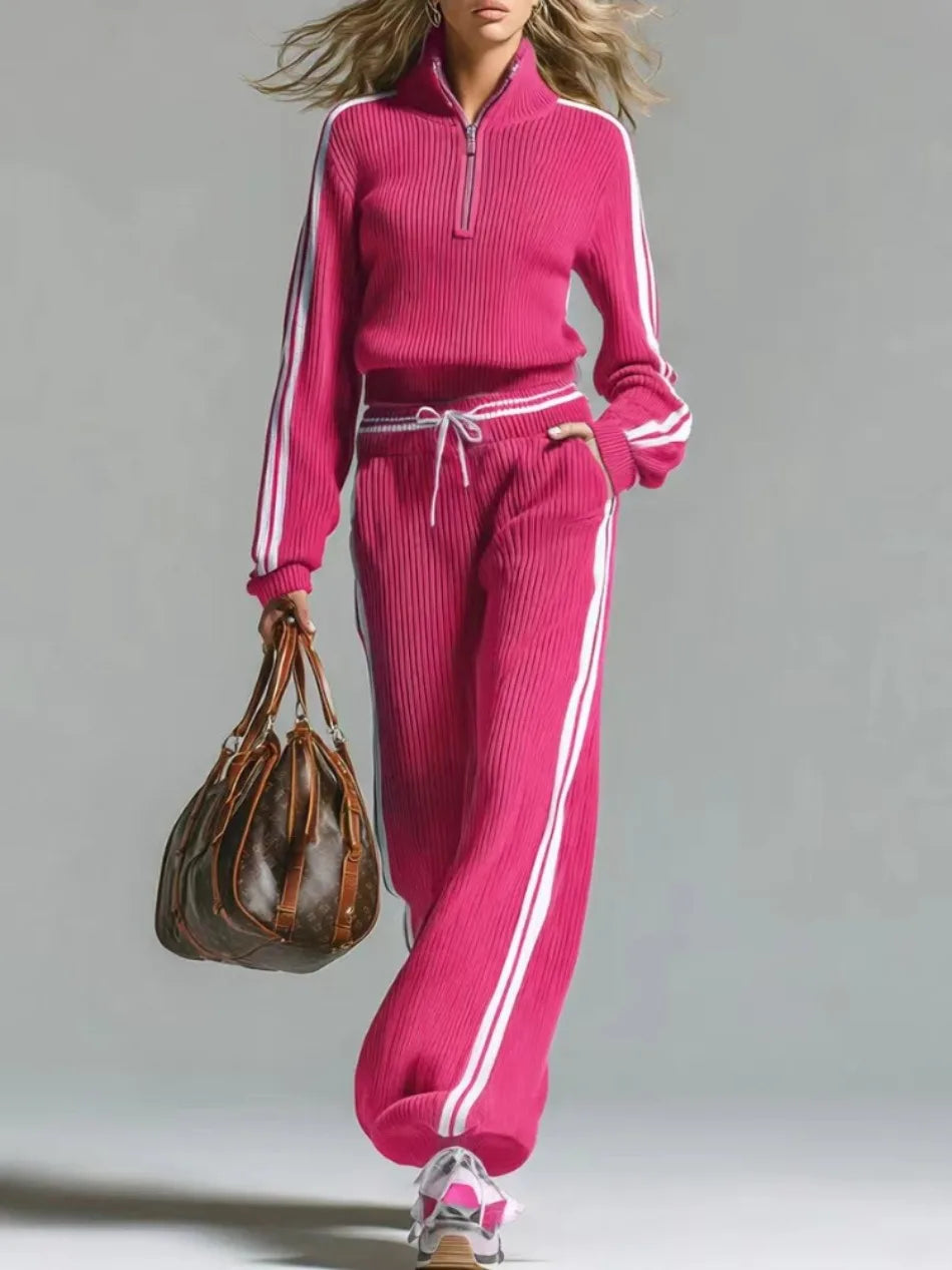 Woman wearing pink ribbed knit two piece set with half zip collar and wide leg pants