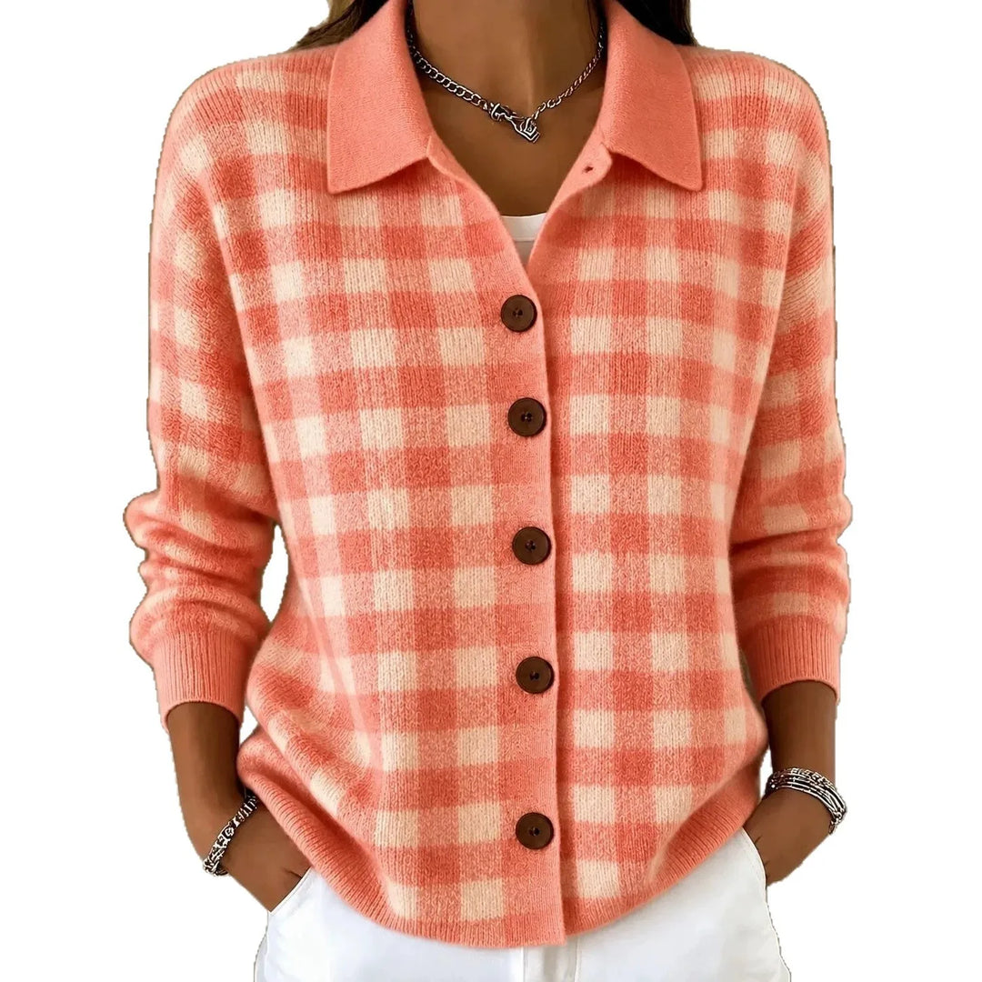Woman wearing coral plaid knit button-front cardigan with point collar on white background