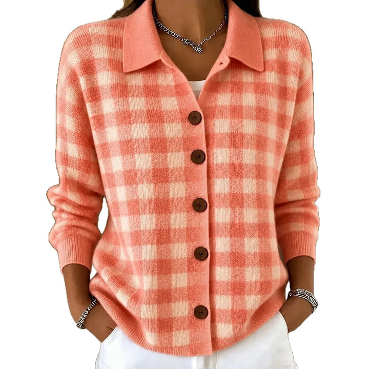 Woman wearing coral plaid knit button-front cardigan with point collar on white background