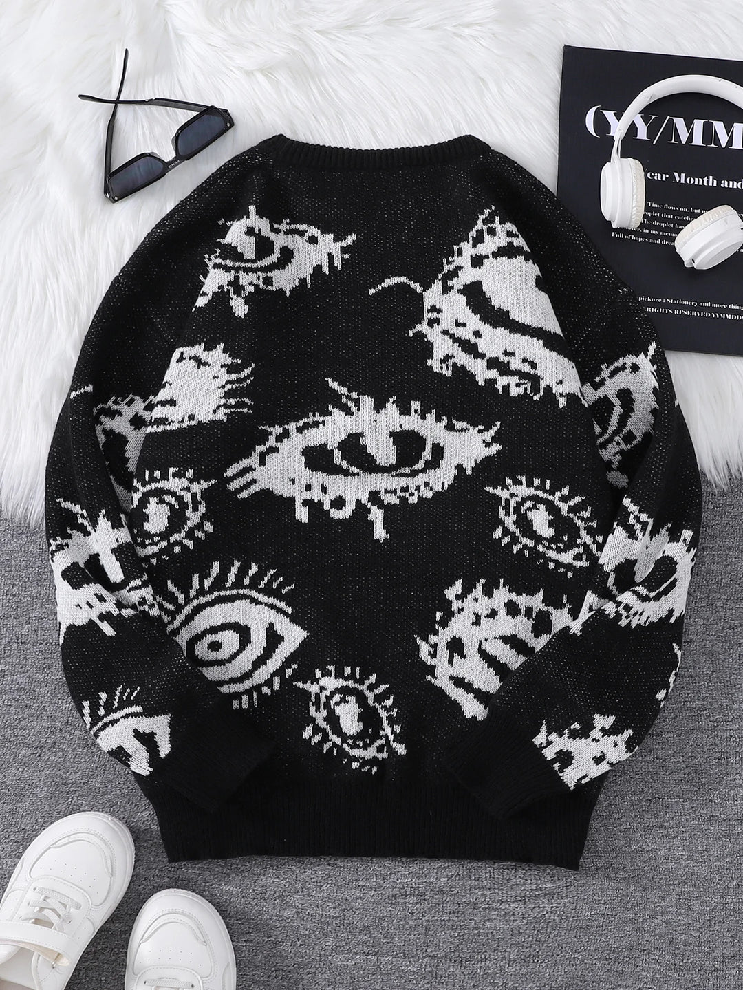 Black eye print sweater back view flat lay