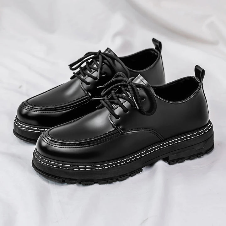 Black leather derby shoes with lace-up front, side by side view