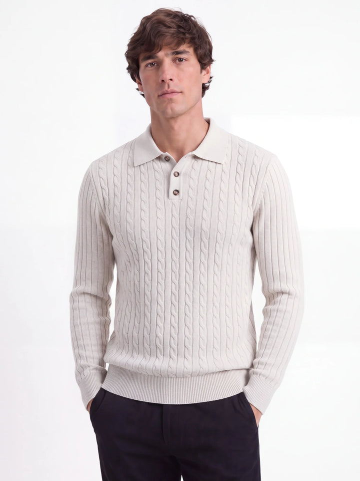 Man wearing apricot cable knit polo sweater