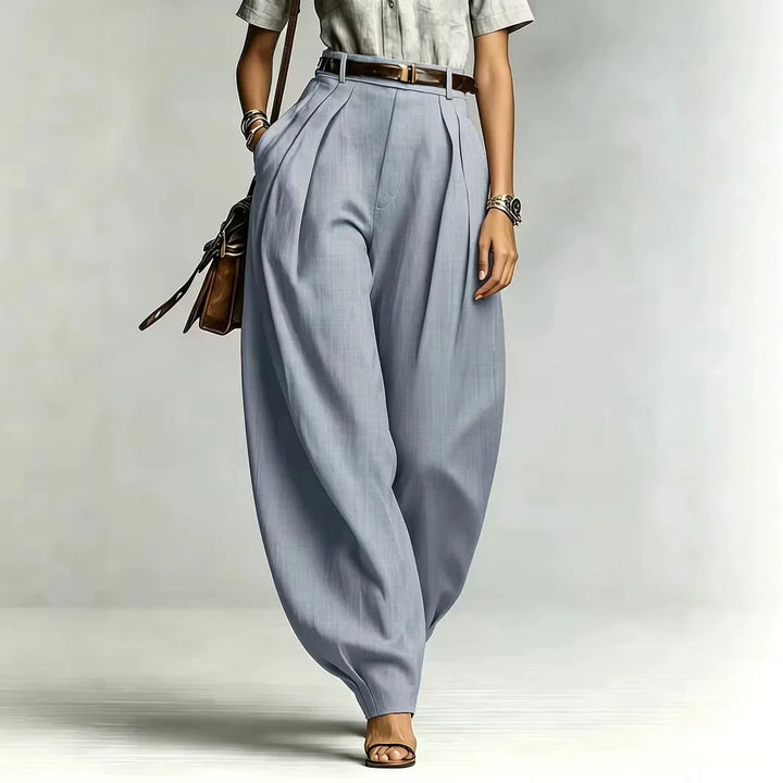Woman wearing light grey balloon wide leg pants, front view