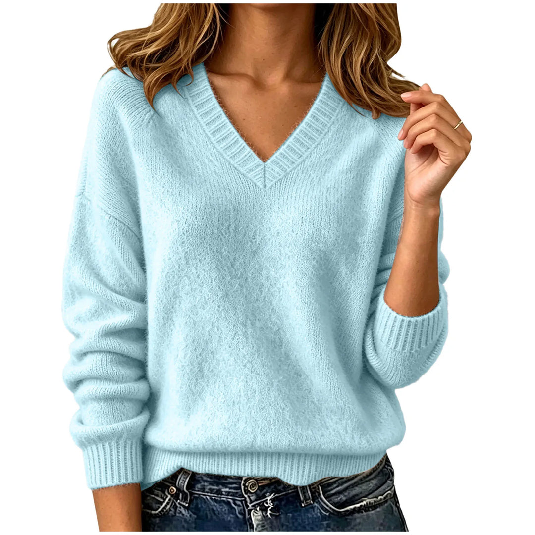 Woman wearing sky blue oversized V-neck knit sweater