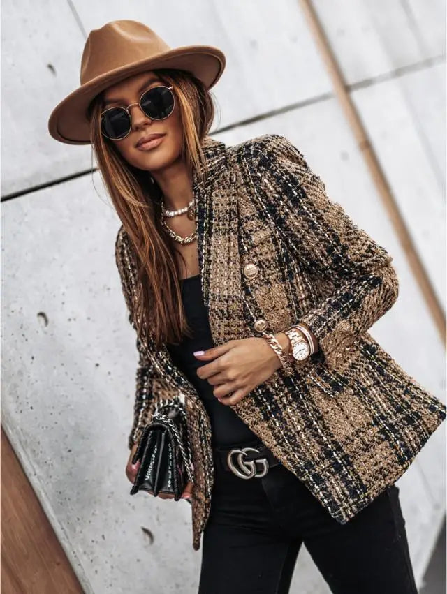 Woman wearing camel plaid double-breasted blazer with black top