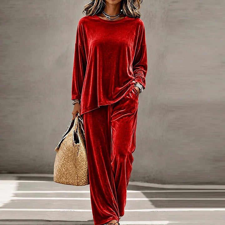 Woman wearing red velvet two piece pants set