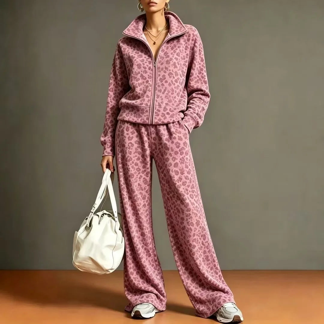Woman wearing pink leopard print zip jacket and wide leg pants set