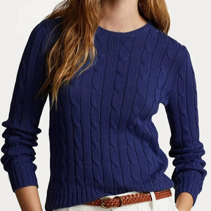 Navy blue cable knit crew neck sweater on model
