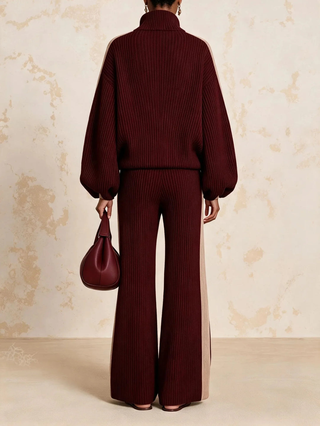 Back view of burgundy color block ribbed knit matching set showing wide leg pants and jacket