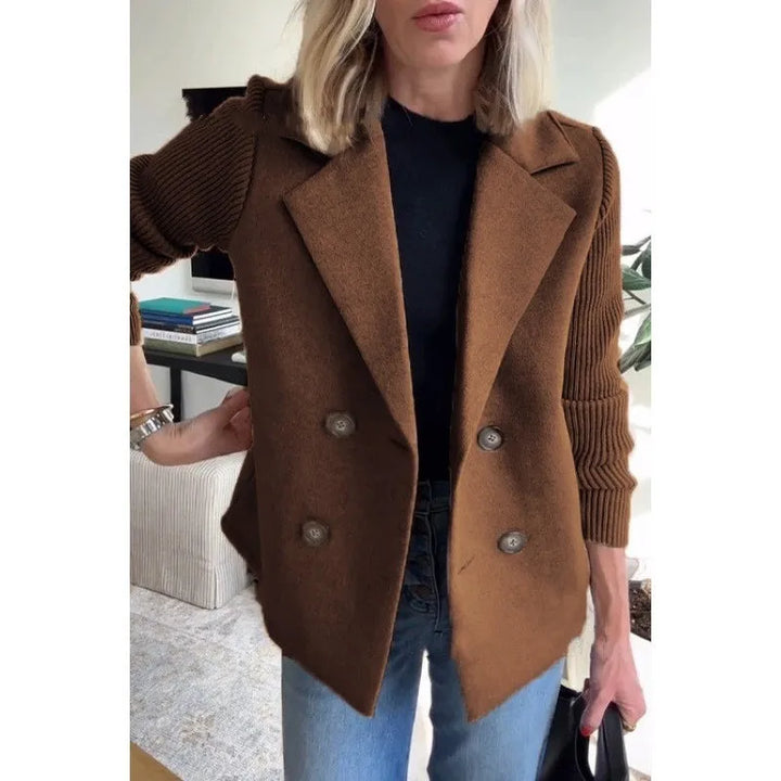 Woman wearing brown double-breasted blazer with ribbed knit sleeves