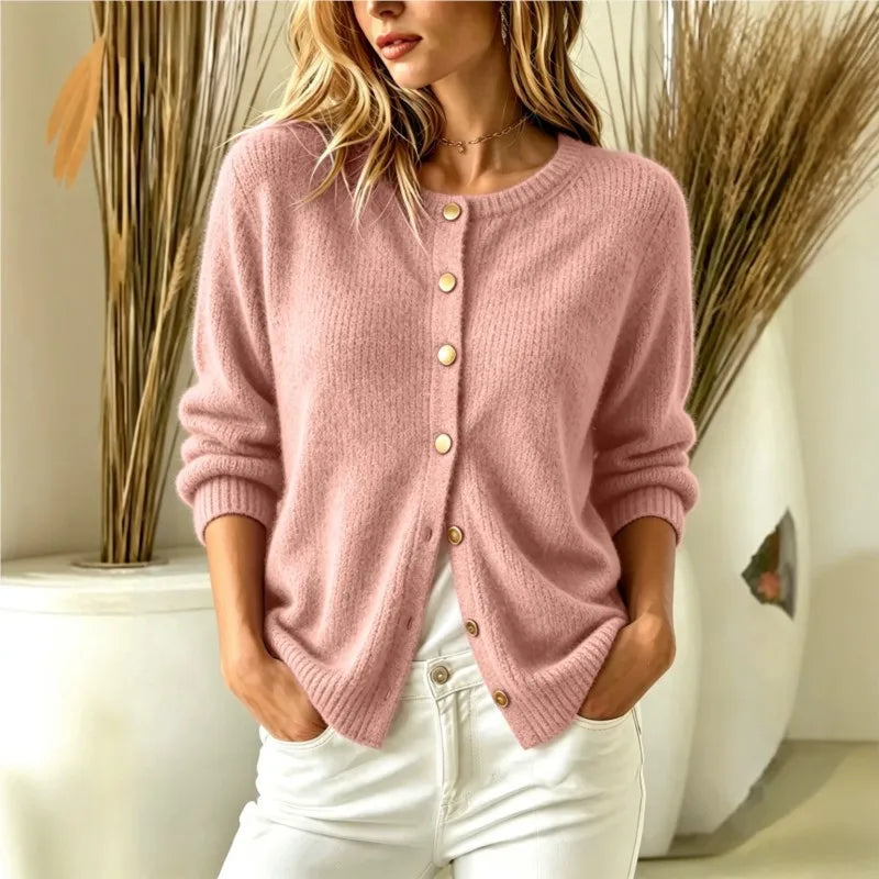 Woman wearing pink ribbed knit button-front cardigan, front view