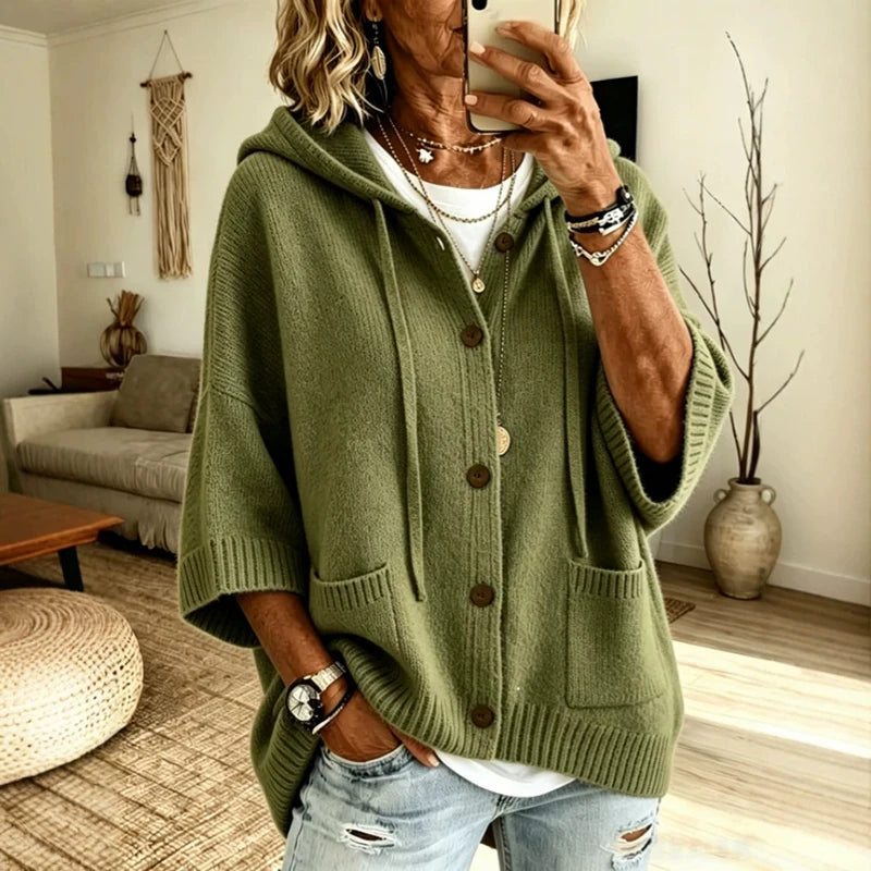 Woman wearing olive green hooded button-front knit cardigan