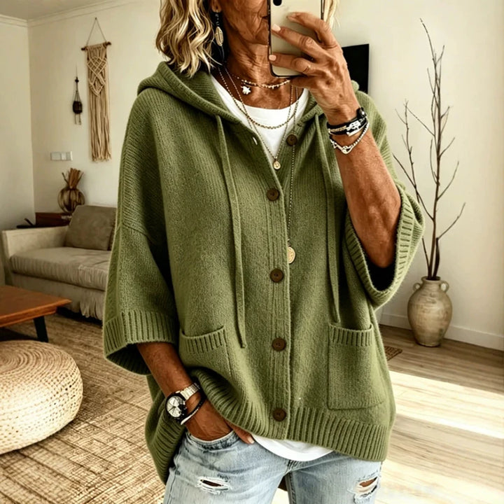 Woman wearing olive green hooded button-front knit cardigan