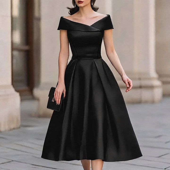 Woman wearing black off-shoulder A-line midi dress